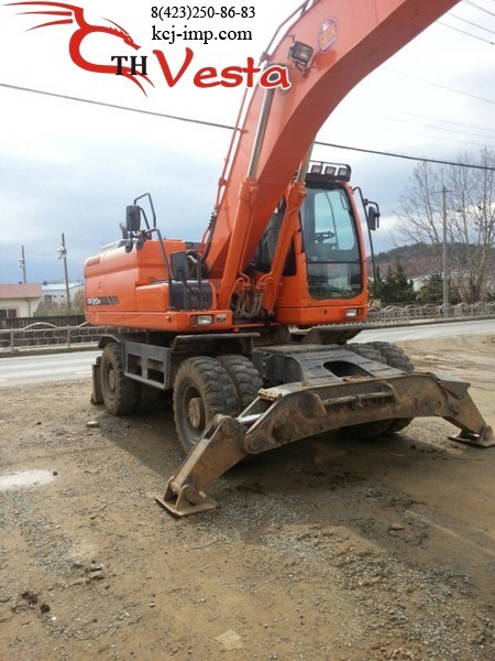 Вес колесного экскаватора. Doosan dx210w. Экскаватор Doosan dx210w. Колесный экскаватор DX 210 WA. Экскаватор колесный Доосан нархи.